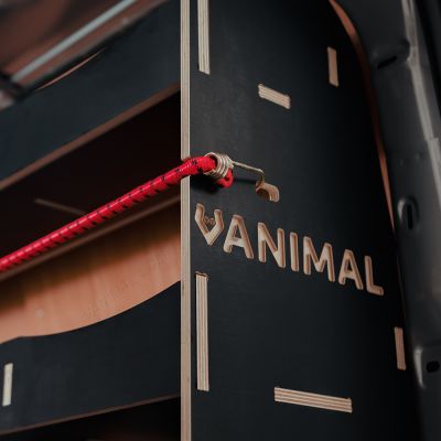 Close-up side panel view of the Vanimal branding