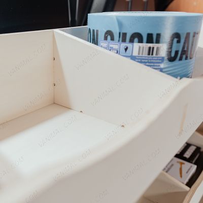 Close-up view of the Transit Custom 2023- Full-Width Bulkhead Racking compartments