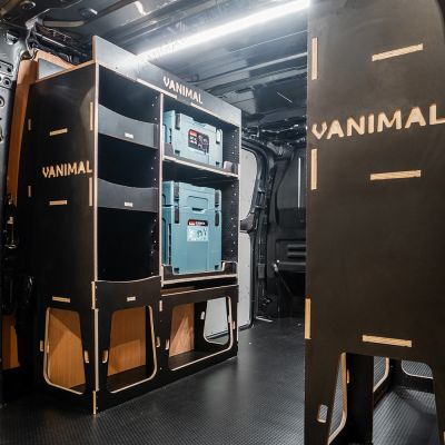 Rear van NS angle view of the Kia PV5 Cargo Makita Makpac Toolbox Compatible Van Racking (x3 V2) displayed with Makita toolboxes and top trays