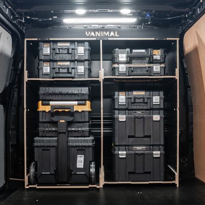 Rear van view of the Kia PV5 Cargo DeWalt TSTAK Trolley Compatible Van Racking - Bulkhead displayed with DeWalt TSTAK trolley, toolboxes and top tray