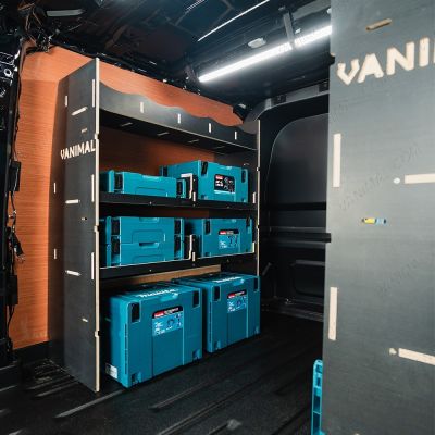 NS rear van view of the VW Transporter T7 Kombi LWB Double MakPac Hexaboard Van Racking displayed with tools and makita toolboxes