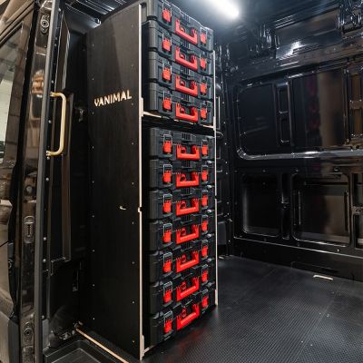 Side van view of the VW Crafter 2017+ Milwaukee Packout Toolbox Compatible Van Racking - Bulkhead displayed with Milwaukee toolboxes