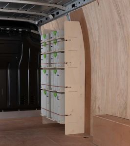 Side angle view of the Nissan NV400 (Interstar) 2011- Front Festool Shelving Racking displayed with bungees cords  