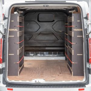 Rear van view of the Transit Custom L1 Hexaboard Triple Racking System with x4 Toolbox Shelves