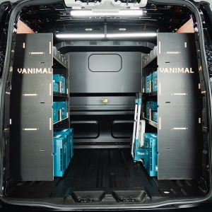 Rear van view of the Ford Transit Custom 2024- Crew Cab Double MakPac Hexaboard Van Racking (Pair) - displayed with makita boxes