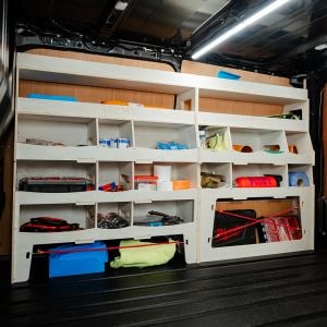 Side van angle view of the Ford Transit Custom 2023- Driver Side Ulti-Rack Van Racking displaying equipment, tools and boxes