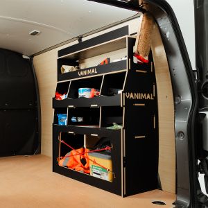 Rear side angle view of the VW Transporter T7 Hexaboard Rear Ulti-Rack Van Racking displaying equipment, tools and boxes
