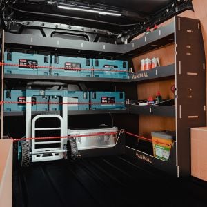 Side angle view of the VW Transporter T5/T6 Hexaboard Front & Bulkhead Makita MakPac Van Racking displaying equipment, tools and boxes