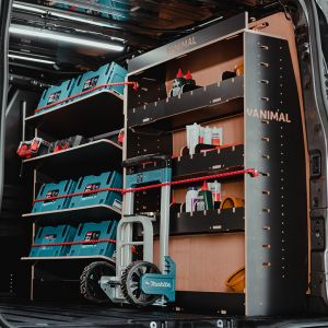 Side angle view of the Ford Transit Custom LWB 2023- Adjustable Driver Side Hexaboard Van Racking and Toolbox Shelving