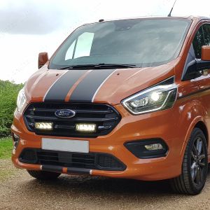 Ford Transit Custom in orange fitted with grille mount light integration kit