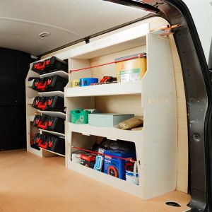 Rear side angle view of the Vauxhall Vivaro B 2014-2019 Driver Side Ulti-Rack Van Racking V2 displaying Milwaukee equipment, tools and boxes