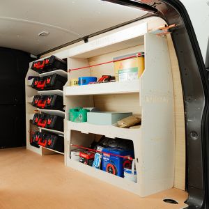 Rear van side angle view of the Nissan NV300 2016- Driver Side Ulti-Rack Van Racking V2 displaying equipment, milwaukee tools and boxes