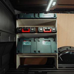 Side van view of the VW Caddy Cargo Maxi 2021- OS Front Racking with x3 Angled Toolbox Shelves displaying makita and milwaukee tools