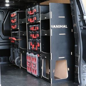 Rear van side angle view of the Kia PV5 Cargo Milwaukee Packout Trolley Compatible Van Racking (Full OS) displayed with Milwaukee toolboxes and trolley