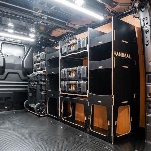 Rear van side angle view of the Ford Transit Custom 2012-2023 DeWalt ToughSystem 2.0 Trolley Compatible Van Racking (Full OS V2) displayed with DeWalt ToughSystem 2.0 toolboxes and trolley