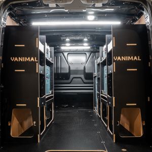 Rear van view of the Ford Transit Custom 2012-2023 Makita Makpac Toolbox Compatible Van Racking (x3 V2) displayed with Milwaukee toolboxes