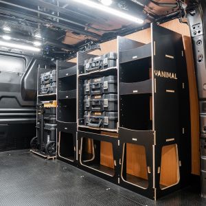 Rear van side angle view of the Ford Transit Custom 2012-2023 L2 DeWalt TSTAK Trolley Compatible Van Racking (Full OS) displayed with DeWalt TSTAK toolboxes and trolley