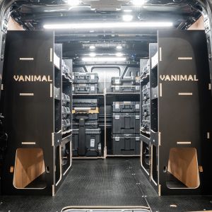 Rear van view of the Ford Transit Custom 2012-2023 L2 DeWalt TSTAK Trolley Compatible Van Racking (x3 V1) displayed with DeWalt TSTAK toolboxes and trolley
