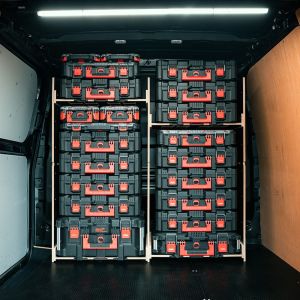 Rear van view of the Kia PV5 Cargo Milwaukee Packout Toolbox Compatible Van Racking - Bulkhead displayed with Milwaukee toolboxes