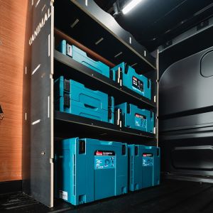 Close-up view of the Transit Custom 2024- LWB Crew Cab NS MakPac Toolbox Hexaboard Van Racking - displayed with Makita Makpac boxes
