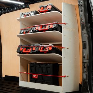 Side angle view of the Ford Transit Custom 2023- SWB OS Rear Toolbox Racking with x3 Shelves displaying milwaukee tools