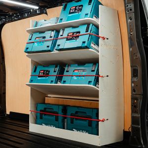 Side angle view of the Ford Transit Custom 2023- SWB OS Rear Toolbox Racking with x3 Shelves displaying makita tools