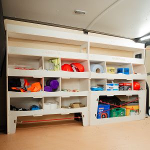 Side van angle view of the Vauxhall Vivaro C 2019- Driver Side Ulti-Rack Van Racking displaying equipment, tools and boxes