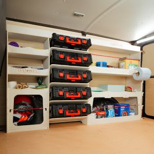 Side angle van view of the Vauxhall Vivaro C 2019- Driver Side Ulti-Rack Van Racking V2 displaying Milwaukee equipment, tools and boxes