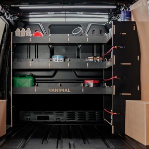 Rear van view of the Ford Transit Custom 2023- Hexaboard Integrated Front Right & Bulkhead Van Racking displaying equipments, tools and boxes