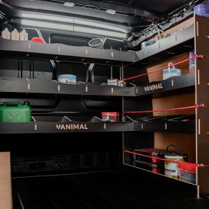 Side angle view of the VW Transporter T5/T6 Hexaboard Integrated Front Right & Bulkhead Racking displaying equipment, tools and boxes