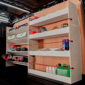 Rear van side angle view of the Nissan NV300 2016- SWB Full Driver Side Ply Racking with Front Toolbox Shelving