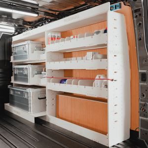 Rear van side angle view of the VW Transporter T7 SWB Adjustable Double Van Racking inc. x3 Storage Boxes