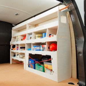 Rear van side angle view of the Nissan NV300 2016- Driver Side Ulti-Rack Van Racking displaying equipment, tools and boxes