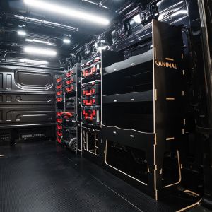 Rear van side angle view of the MAN TGE 2017+ Milwaukee Packout Trolley Compatible Van Racking (Full OS V2) displayed with Milwaukee toolboxes