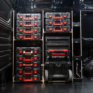 Side van view of the MAN TGE 2017+ Milwaukee Packout Trolley Compatible Van Racking - Front displayed with Milwaukee toolboxes and trolley