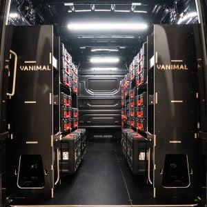 Rear van view of the MAN TGE 2017+ Milwaukee Packout Trolley Compatible Van Racking (x3 V1) displayed with Milwaukee toolboxes and trolley