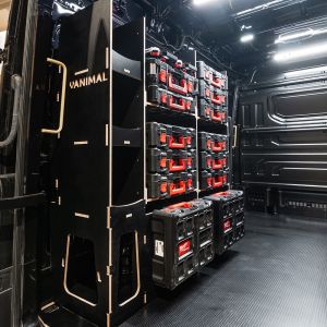 Rear van side angle view of the MAN TGE 2017+ Milwaukee Packout Toolbox Compatible Van Racking - NS Rear displayed with Milwaukee toolboxes