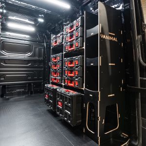 Rear van side angle view of the MAN TGE 2017+ Milwaukee Packout Toolbox Compatible Van Racking - OS Rear displayed with Milwaukee toolboxes