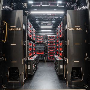 Rear van view of the MAN TGE 2017+ Milwaukee Packout Trolley Compatible Van Racking (x3 V3) displayed with Milwaukee toolboxes and trolley