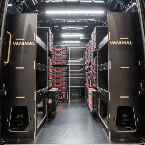 Rear van view of the MAN TGE 2017+ Milwaukee Packout Toolbox and Trolley Van Racking (x4 V2) displayed with Milwaukee toolboxes and trolley