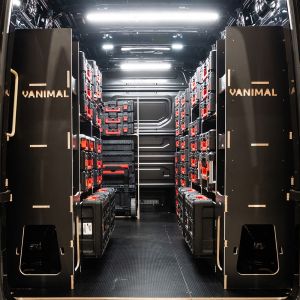 Rear van view of the MAN TGE 2017+ Milwaukee Packout Trolley and Toolbox Van Racking (x4 V1) displayed with Milwaukee toolboxes and trolley