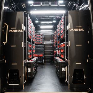 Rear van view of the MAN TGE 2017+ Milwaukee Packout Trolley Compatible Van Racking (x4 V1) displayed with Milwaukee toolboxes and trolleys