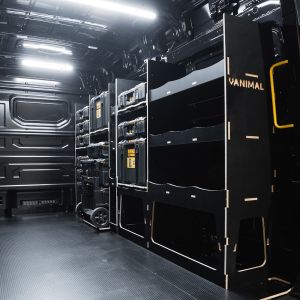 Rear van side angle view of the MAN TGE 2017+ DeWalt ToughSystem 2.0 Trolley Compatible Van Racking (Full OS V2) displayed with DeWalt ToughSystem 2.0 toolboxes and trolley