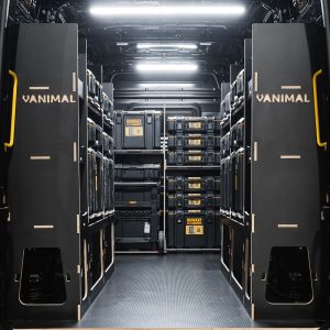 Rear van view of the MAN TGE 2017+ DeWalt ToughSystem 2.0 Trolley Compatible Van Racking (x3 V3) displayed with DeWalt ToughSystem 2.0 toolboxes and trolley