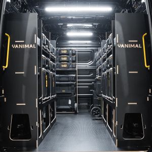 Rear van view of the MAN TGE 2017+ DeWalt ToughSystem 2.0 Trolley Compatible Van Racking (x4 V1) displayed with DeWalt ToughSystem 2.0 toolboxes and trolleys