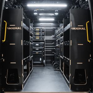 Rear van view of the MAN TGE 2017+ DeWalt ToughSystem 2.0 Trolley Compatible Van Racking (x4 V2) displayed with DeWalt ToughSystem 2.0 toolboxes and trolleys