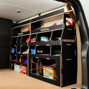 Rear side angle view of the Nissan NV300 2016- Hexaboard Driver Side Ulti-Rack Van Racking displaying equipment, tools and boxes