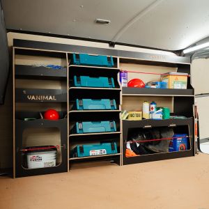 Side van angle view of the Nissan NV300 2016- Hexaboard Driver Side Ulti-Rack Van Racking V2 displaying equipment, makita tools and boxes