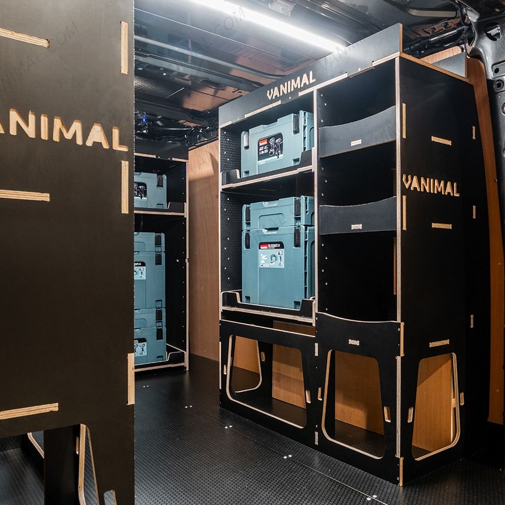 Rear van OS angle view of the Kia PV5 Cargo Makita Makpac Toolbox Compatible Van Racking (x3 V1) displayed with Makita toolboxes and top trays