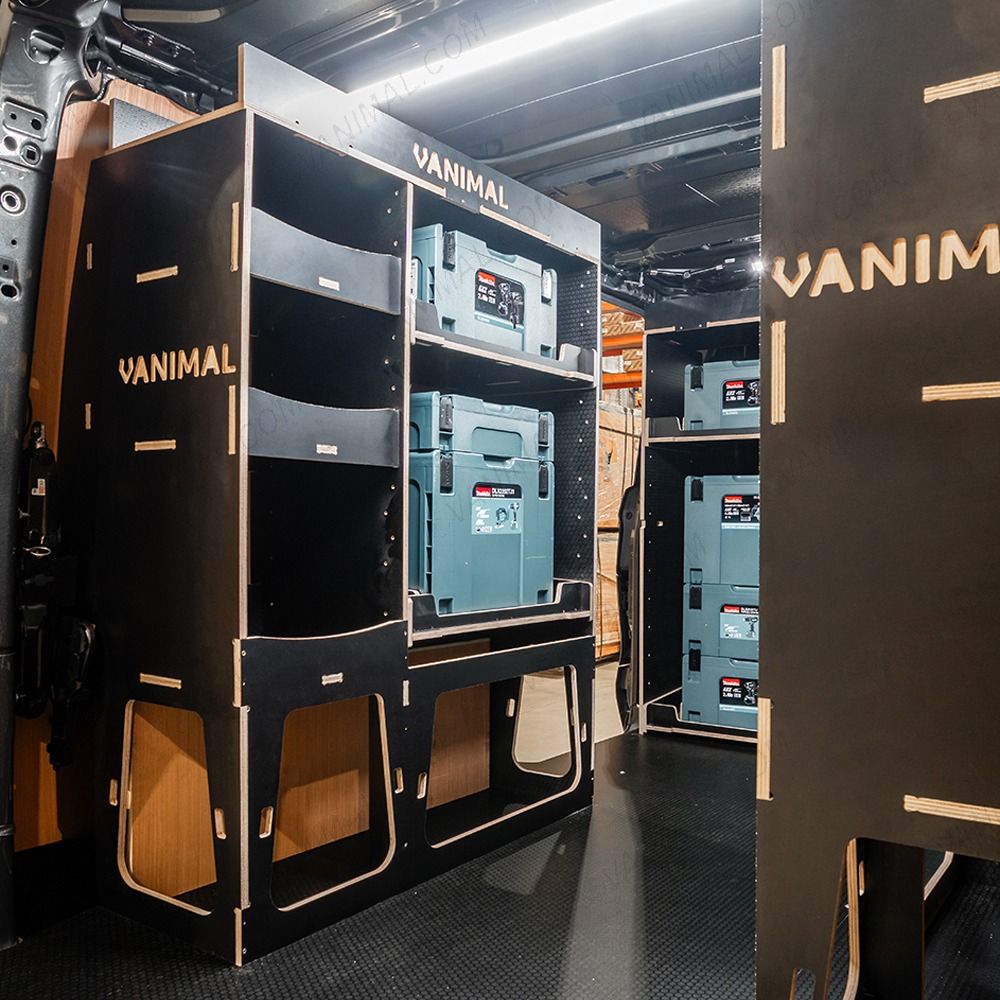 Rear van NS angle view of the Kia PV5 Cargo Makita Makpac Toolbox Compatible Van Racking (x3 V1) displayed with Makita toolboxes and top trays 